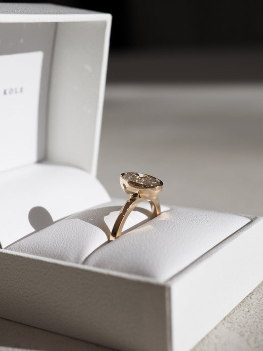 Should I choose a low or raised setting for the Via engagement ring?