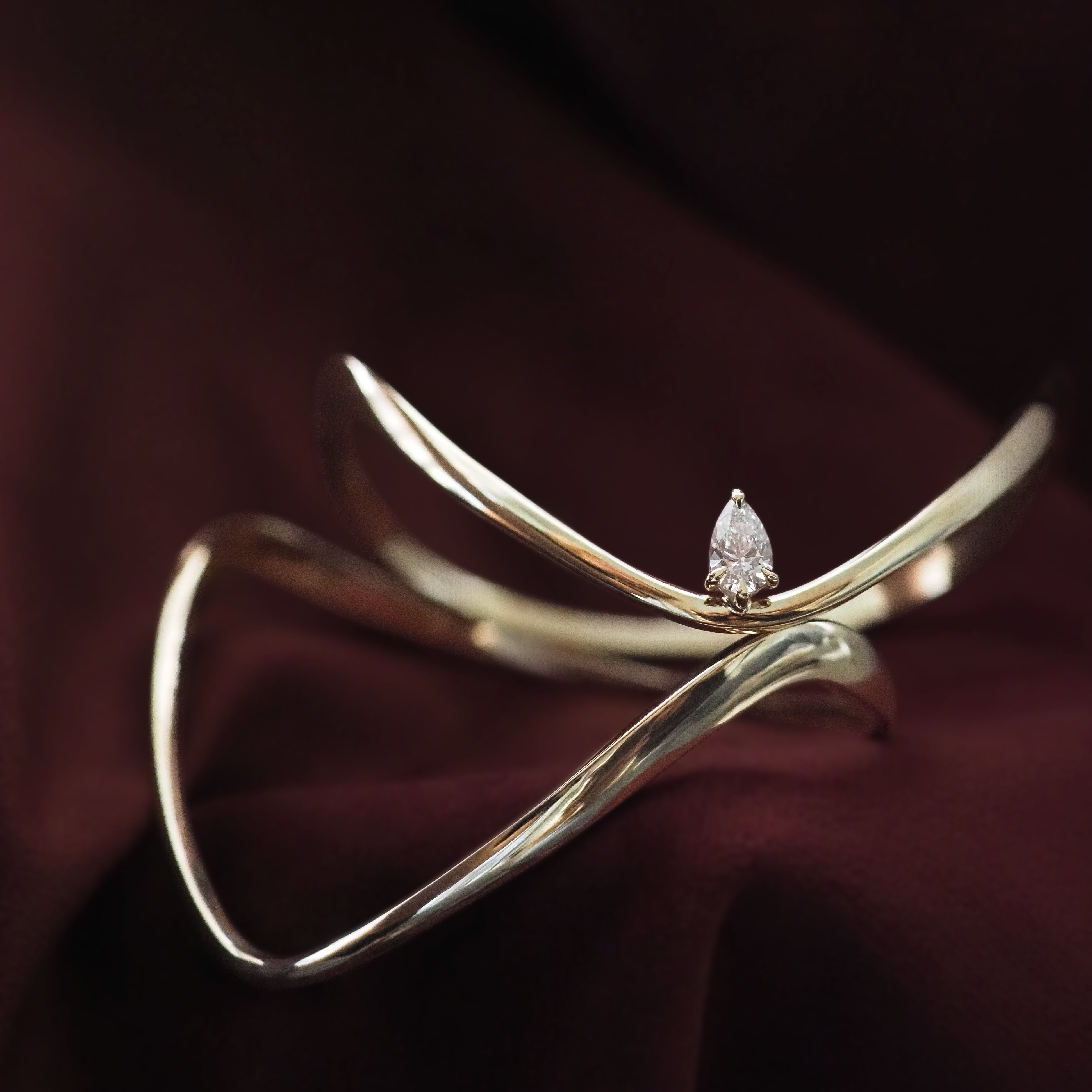 Gold bracelet with a diamond on a dark background
[text overlay: Piece 5—The Forme Bangle (top), Piece 8—The Sol Bangle (bottom)]