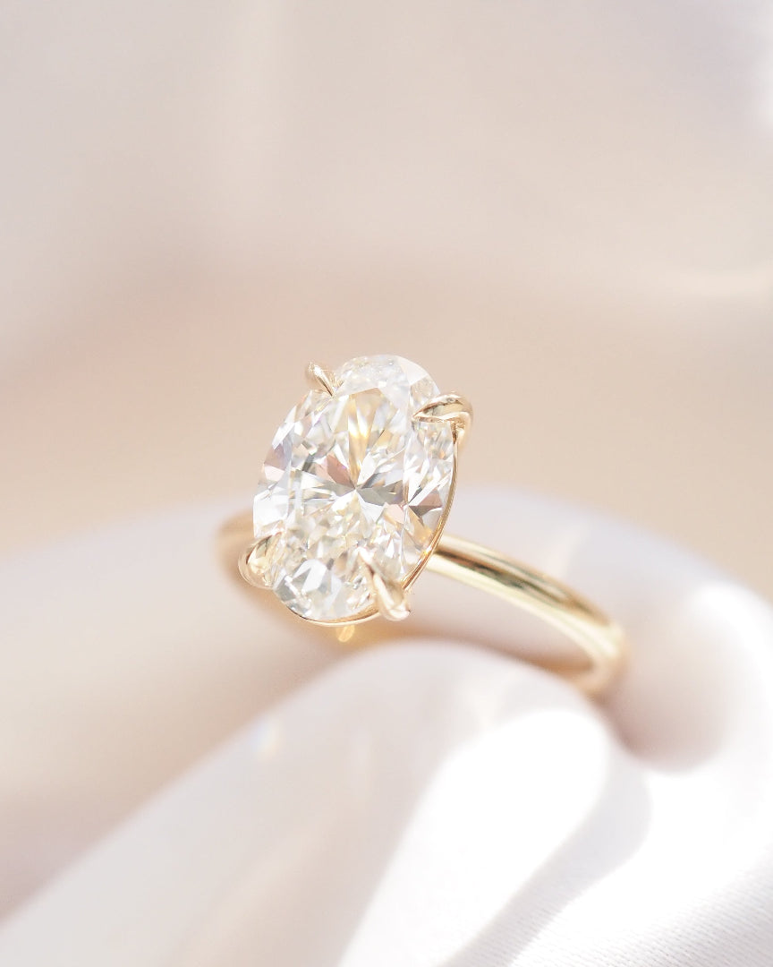 Oval diamond ring with gold band