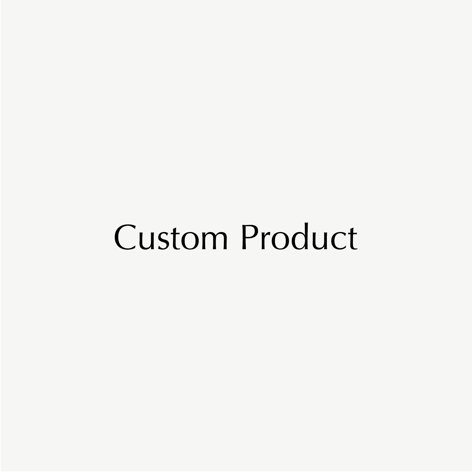 Text "Custom Product" in elegant black font on a light grey background, suggesting bespoke luxury jewellery offerings.