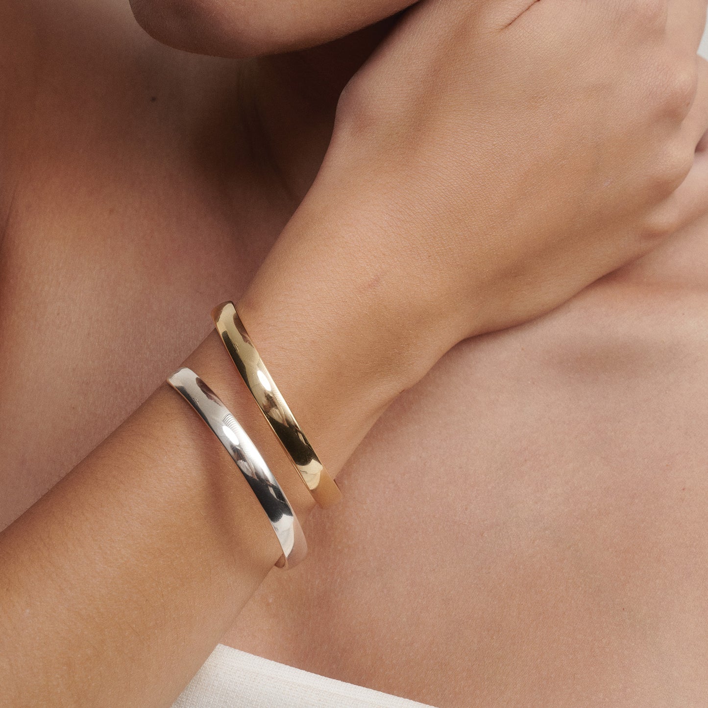 Our Extra Small (60mm) Cuff stacked in Silver and 9ct Yellow Gold
