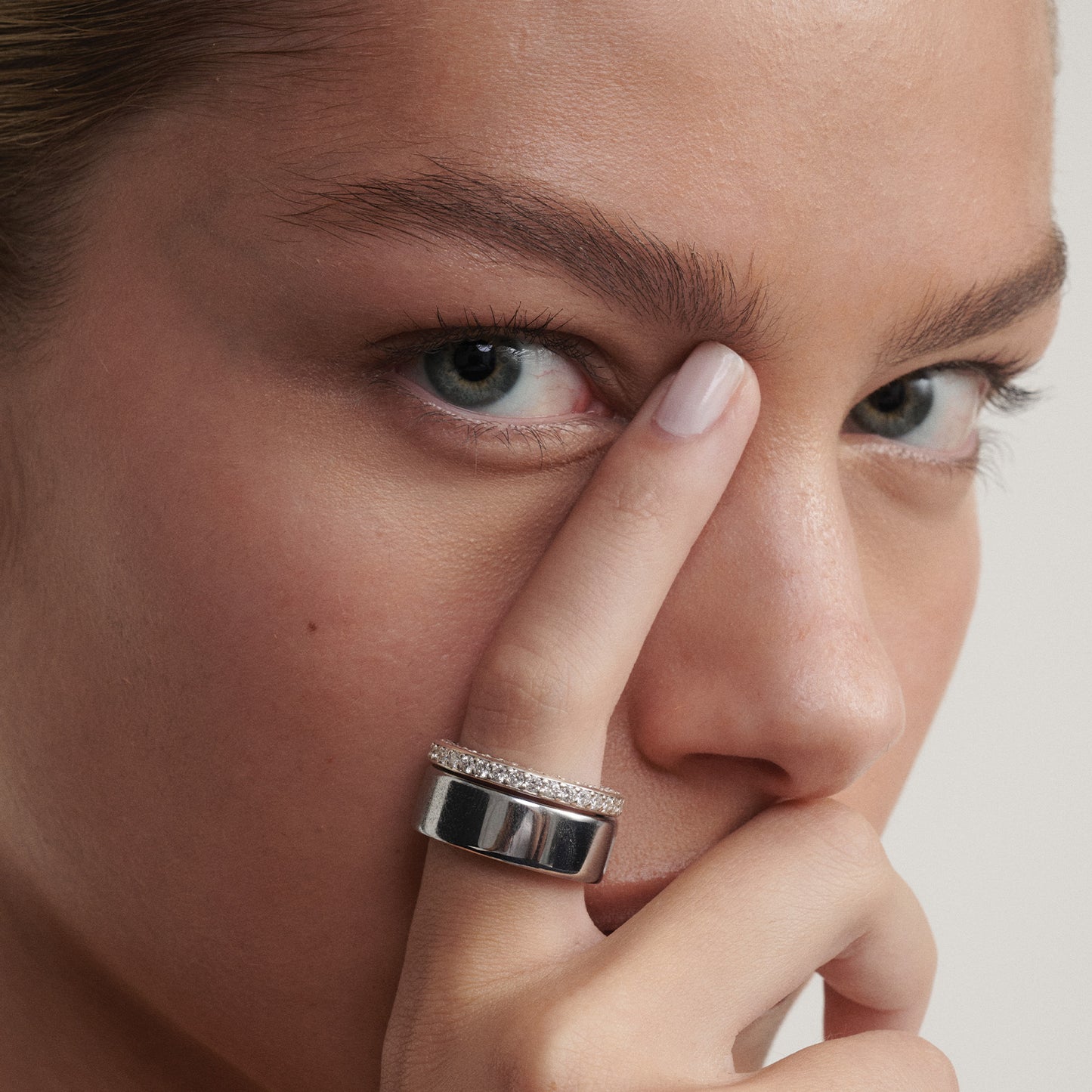 [text overlay: Our Wellness Ring (18ct White Gold, 8) stacked with the Oura Ring]