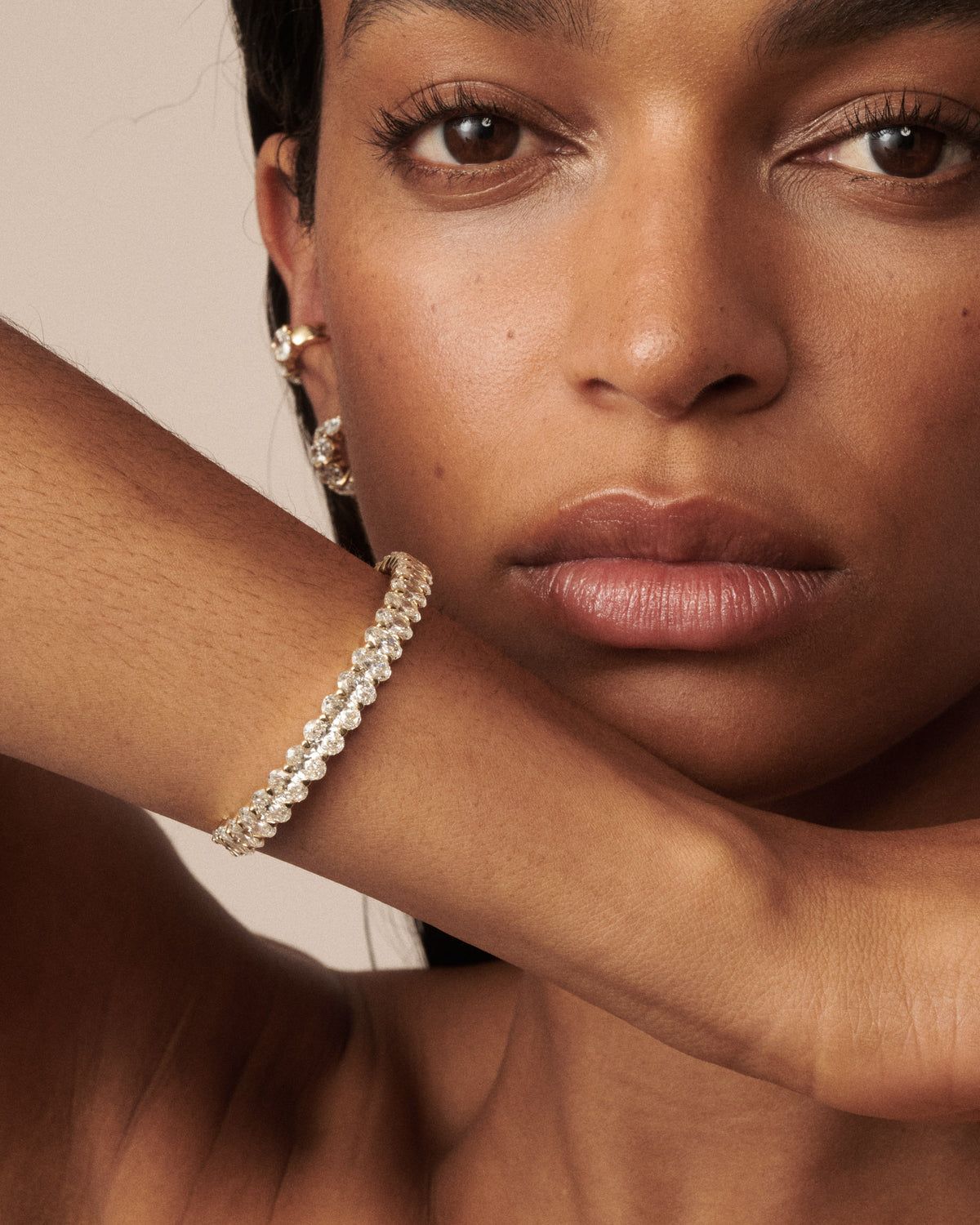 Lab-grown diamond bracelet with continuous row of oval-cut stones, close-up