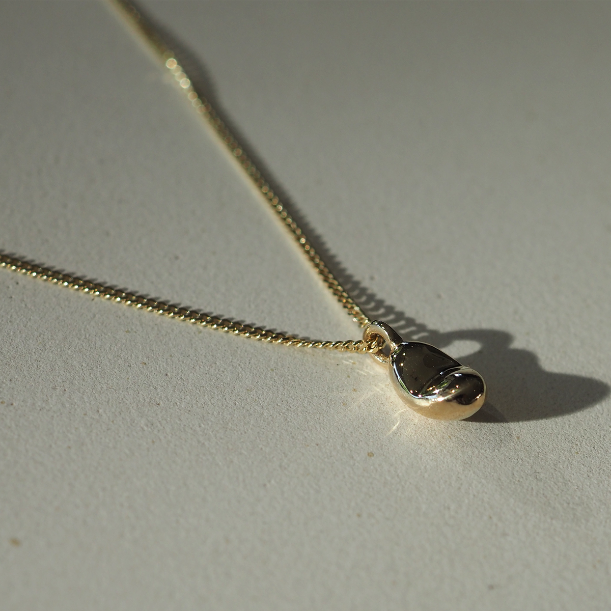 Baby in Time pendant on diamond curb chain, hand finished in Newcastle