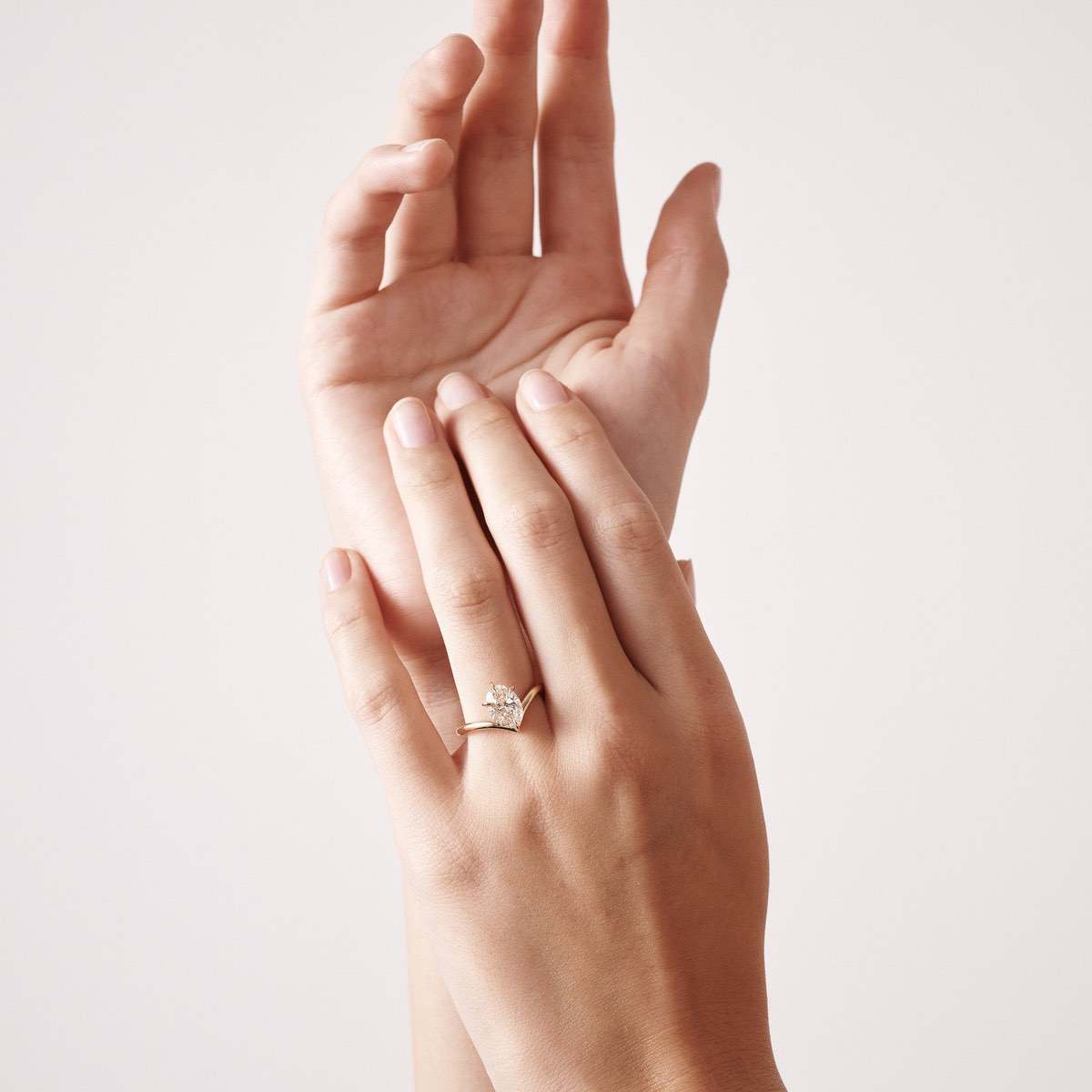 A piece that provides the breathtaking illusion of a floating oval lab-grown diamond, consciously caressing the surface of the finger - set in solid 18ct yellow gold