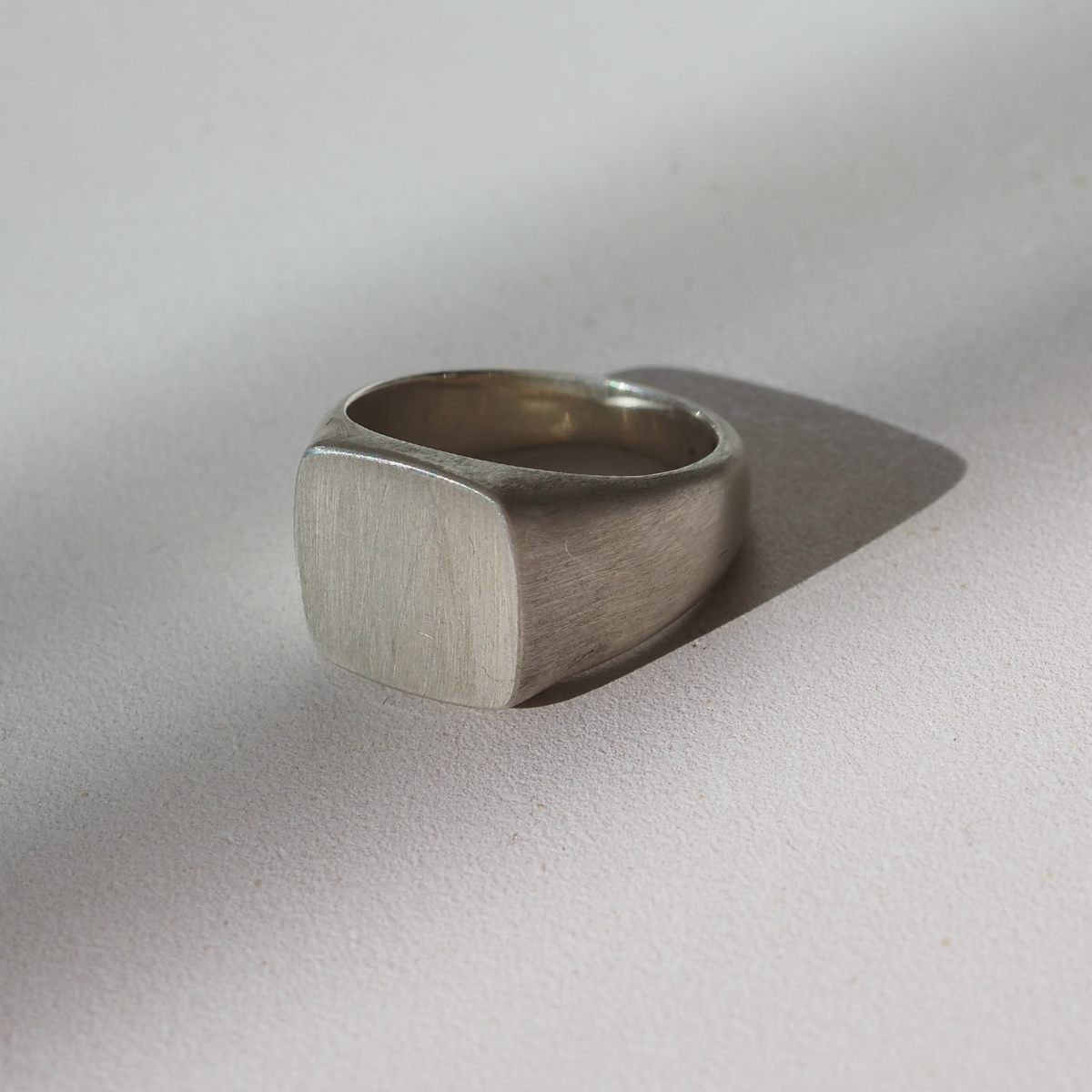 Based on a medium ring size, the face of our square signet measures 12mm square. The underside features a half round band measuring from a 3mm minimum width.