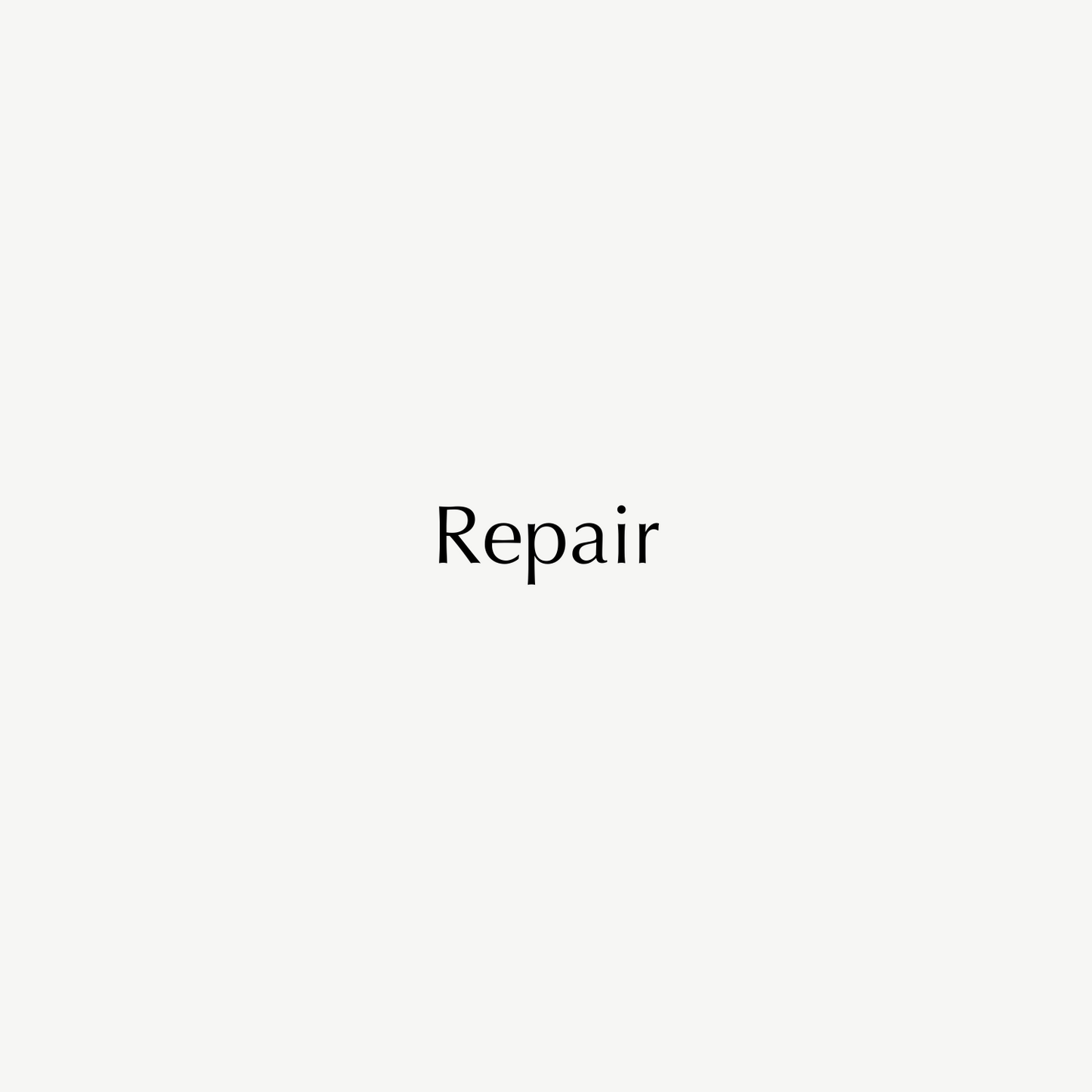 Minimalist white background image with the word "Repair" in elegant, uppercase black text, suggesting luxury jewellery restoration services.